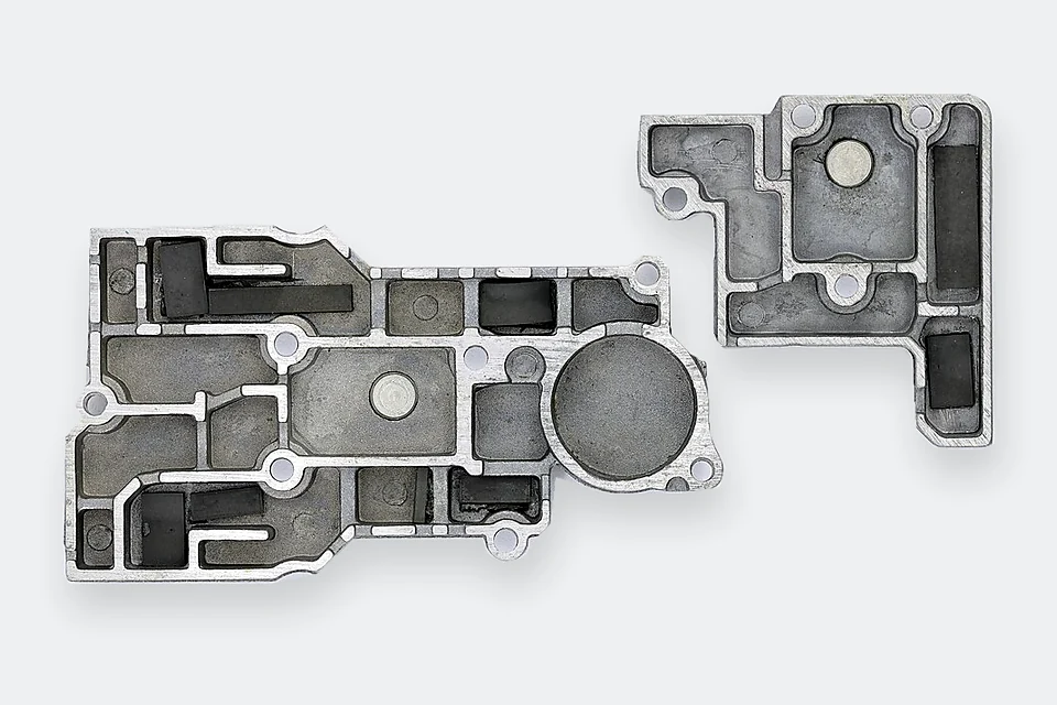 Aluminum die-cast covers showing ribs, recesses and mounting features