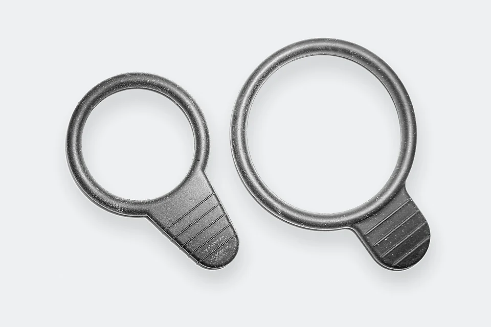 Two molded rubber retaining rings with grip tabs